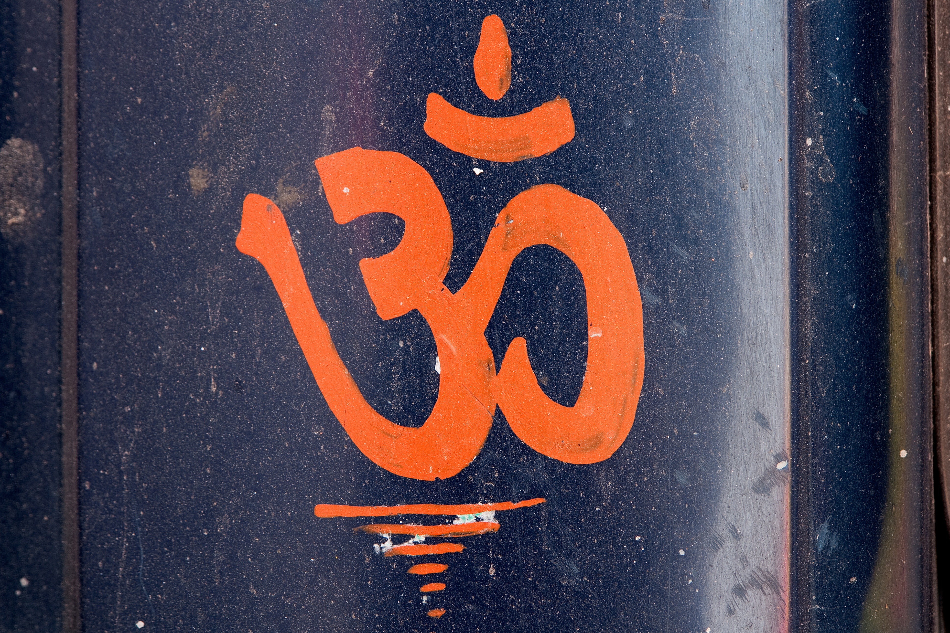 black and orange hindu letter