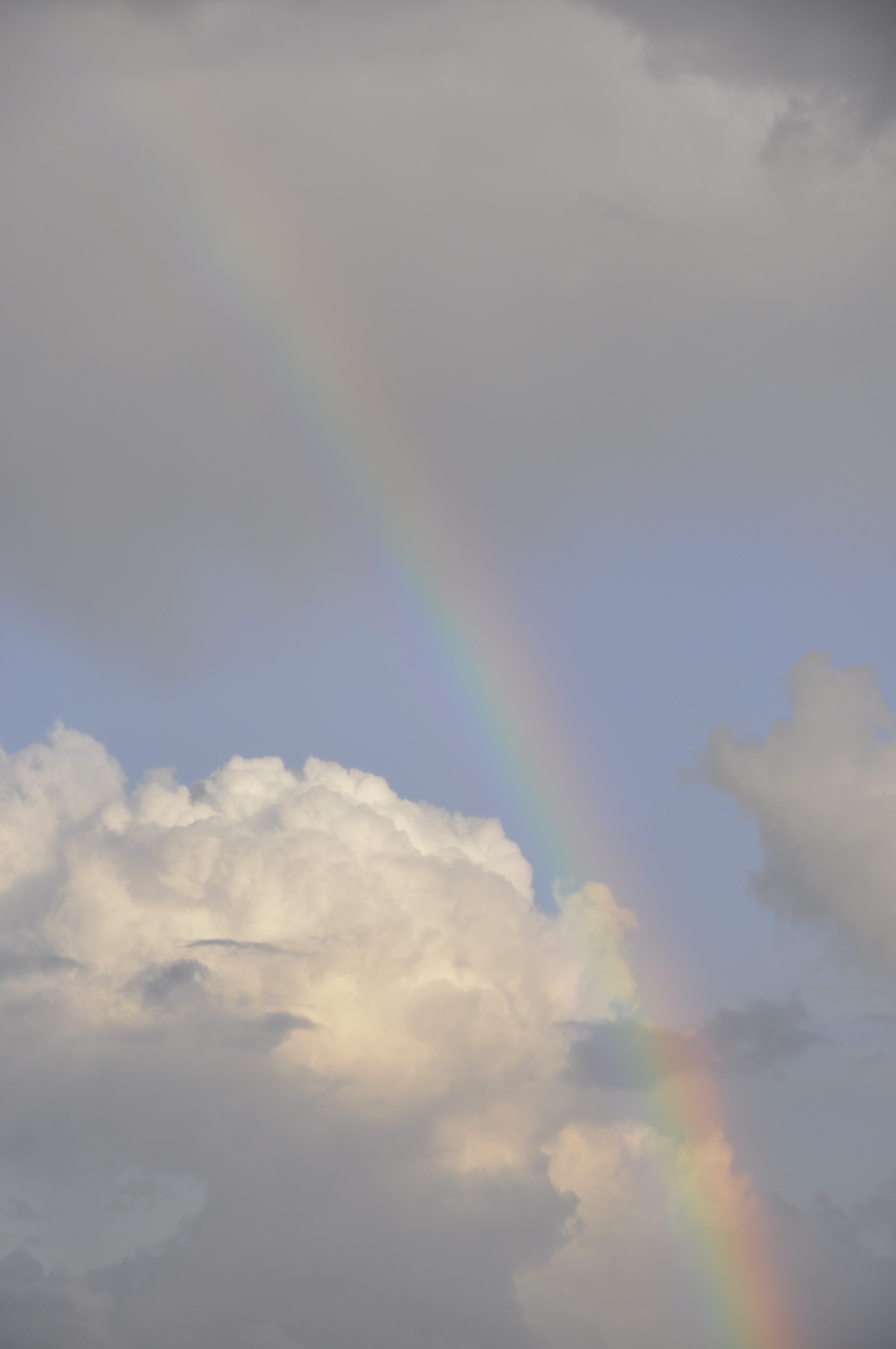 rainbow with white clouds