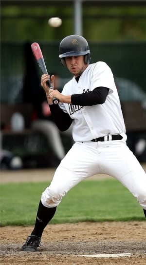 baseball player in white jersey holding black and red baseball bat thumbnail