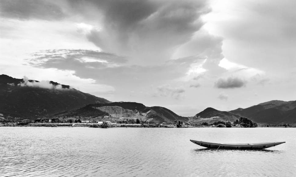 boat sailing on the body of water in grayscale photo preview
