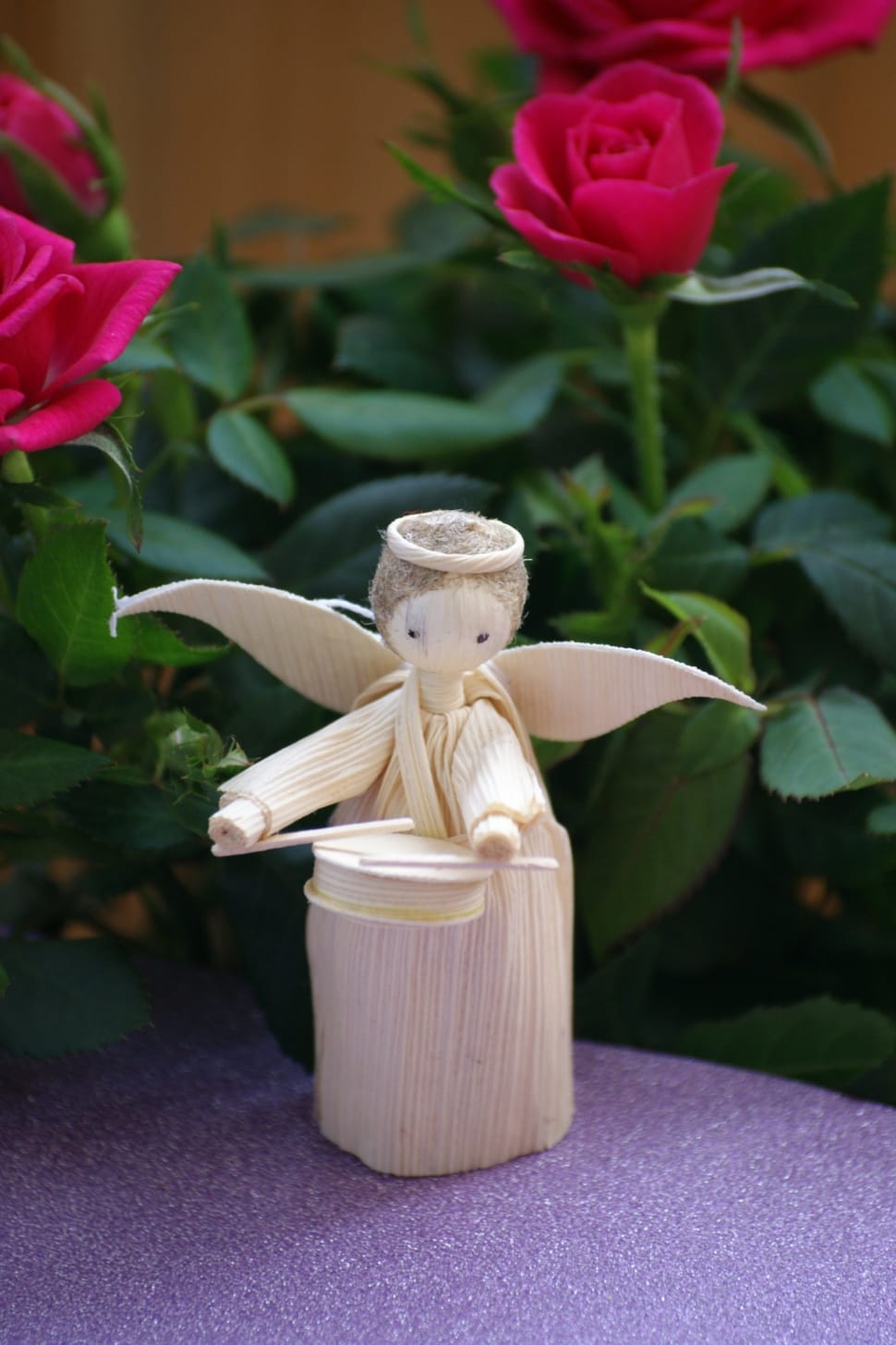 beige angel playing drum stick figurine preview