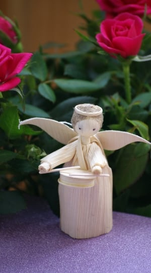 beige angel playing drum stick figurine thumbnail
