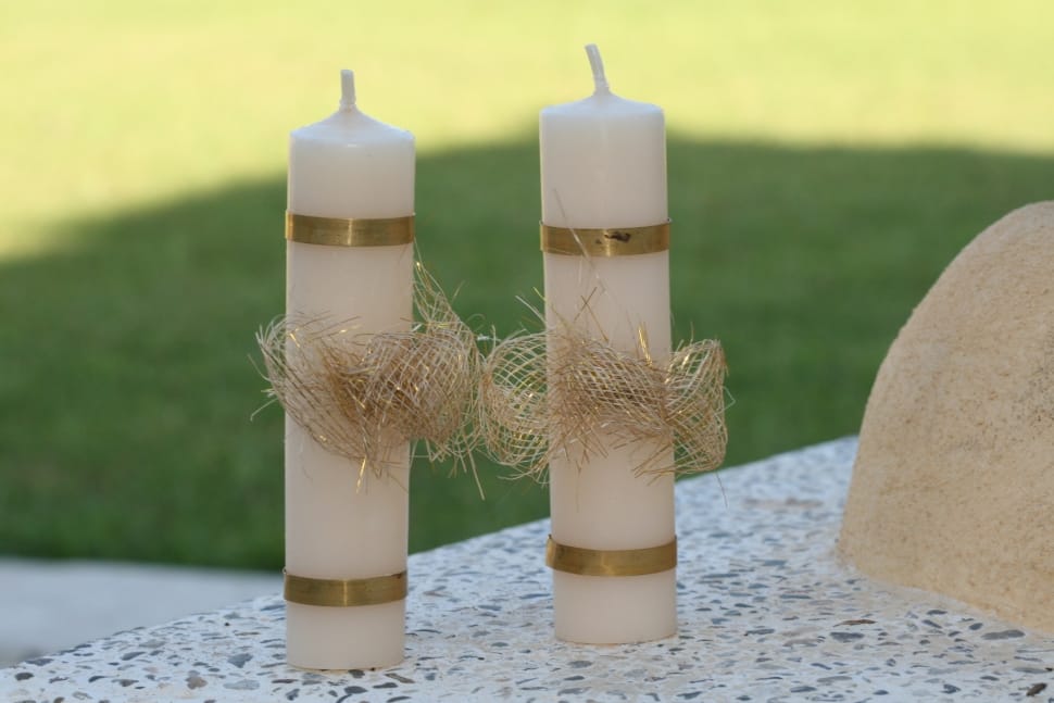 2 white pillar candles preview