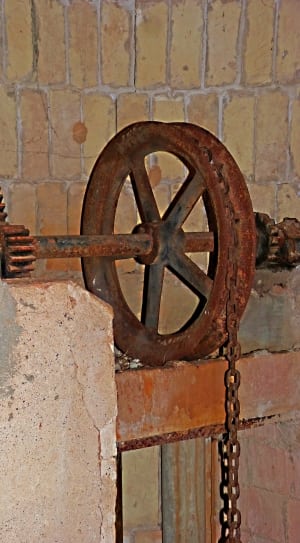 close up photo of brown metal pulley chain equipment thumbnail