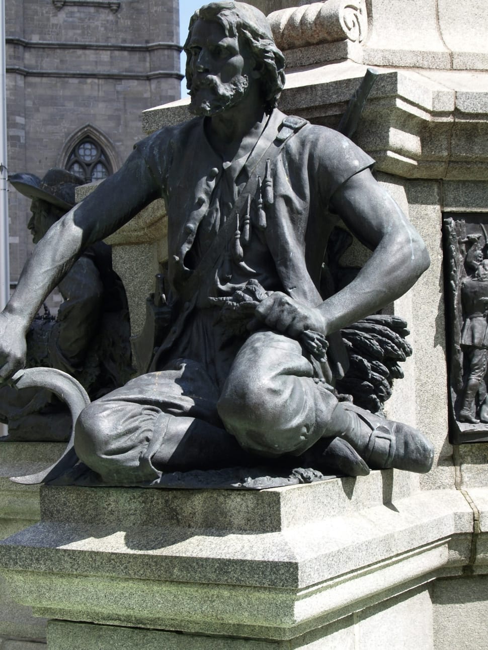 man sitting concrete statue preview