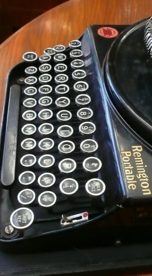 black remington portable type writer thumbnail