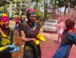 three people during a holi festival thumbnail