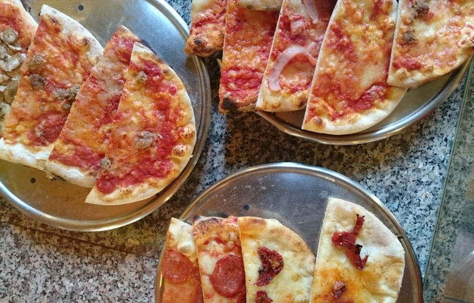 pizza slice on stainless steel plate preview