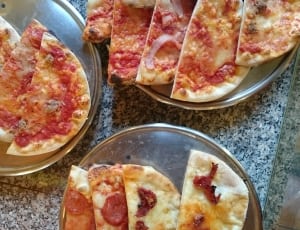 pizza slice on stainless steel plate thumbnail