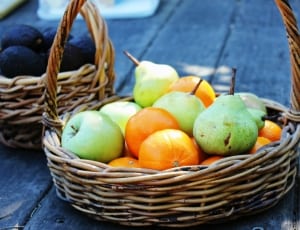 brown wicker basket with peaches apples and oranges thumbnail