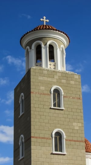 gray and white cathedral bell tower under blue sky thumbnail