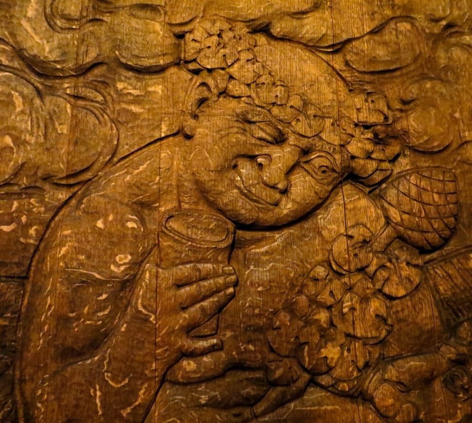 brown wood carving of mother and child preview