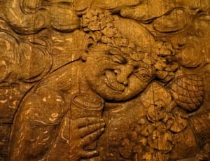 brown wood carving of mother and child thumbnail