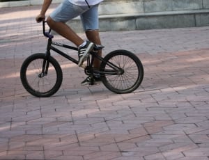 person riding on black BMX bike thumbnail