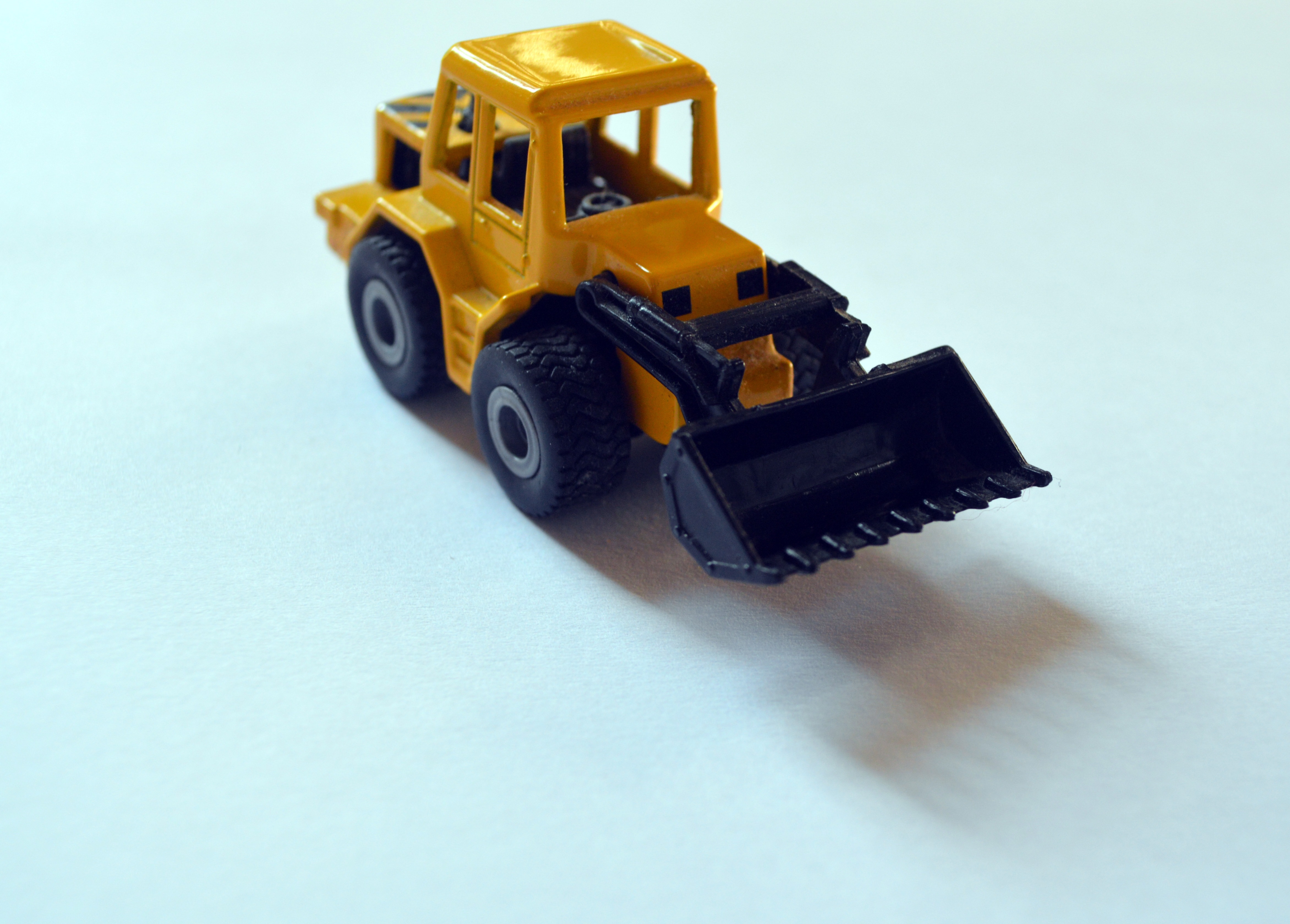 toddler's yellow and black front loader toy