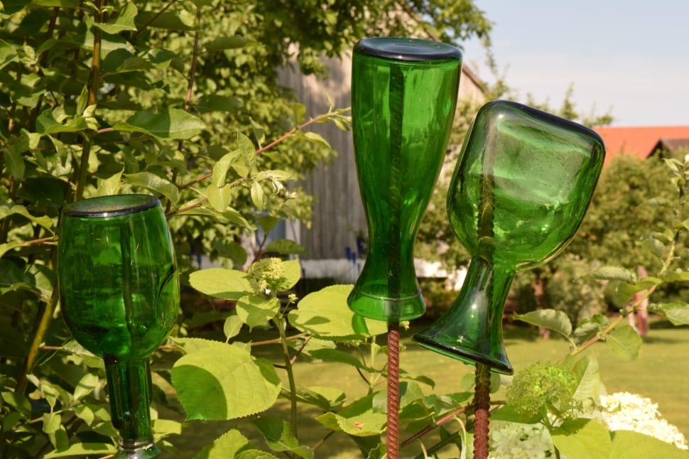 three green glass bottles preview