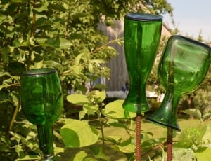 three green glass bottles thumbnail