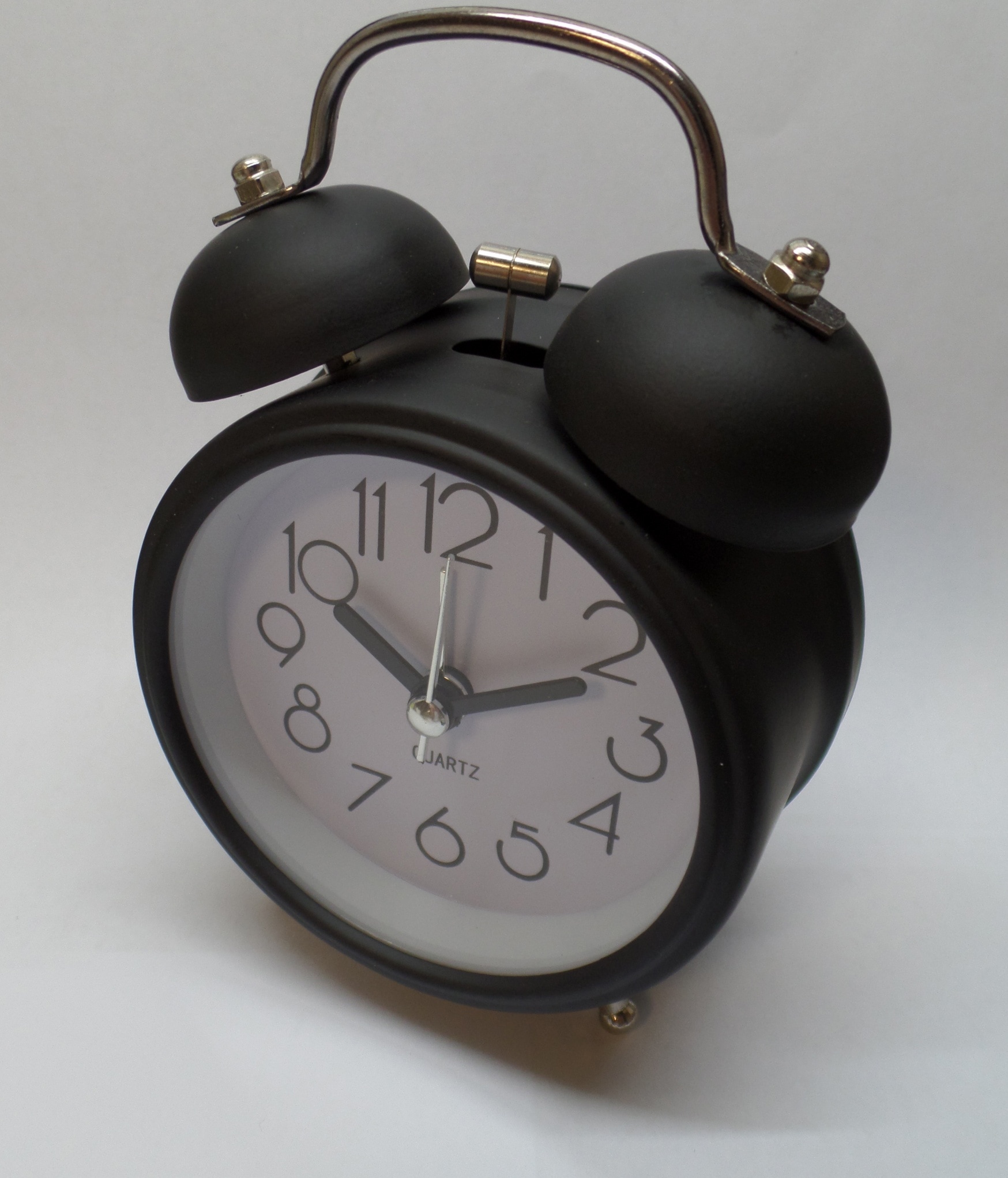 black analog alarm clock