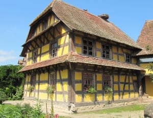 yellow and brown two storey house thumbnail
