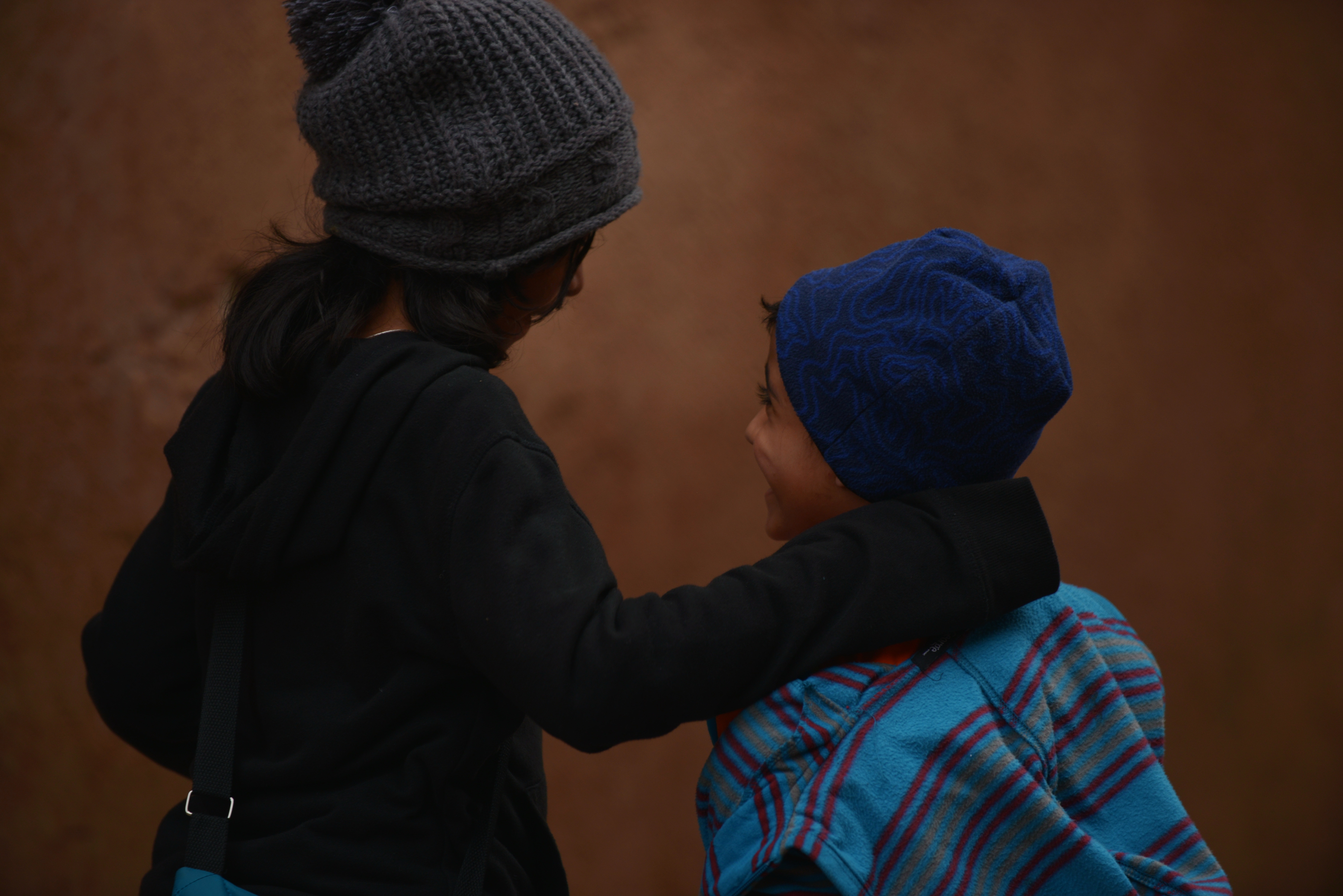 girl and boy wearing knit cap
