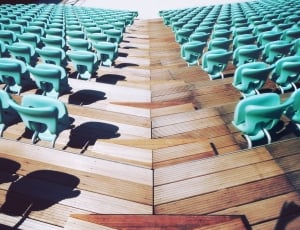 photo of aligned green chairs on brown hardwood floor thumbnail