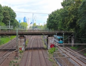 brown steel train rails over the bridge photoghrapy during daytime thumbnail