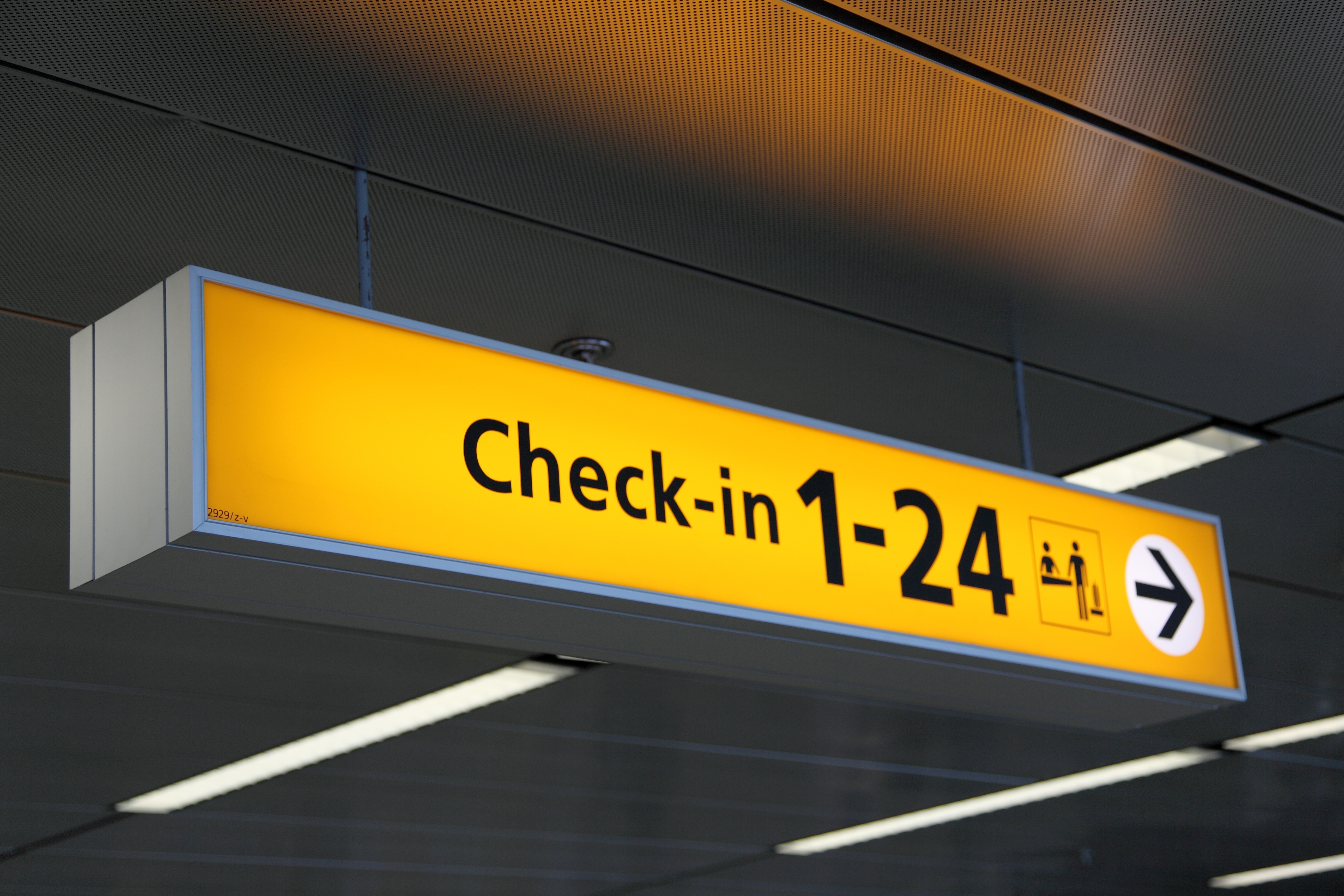 yellow and silver check in 1-24 signage