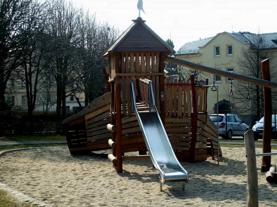 brown wooden swing and slide set preview