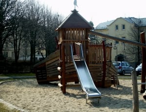 brown wooden swing and slide set thumbnail