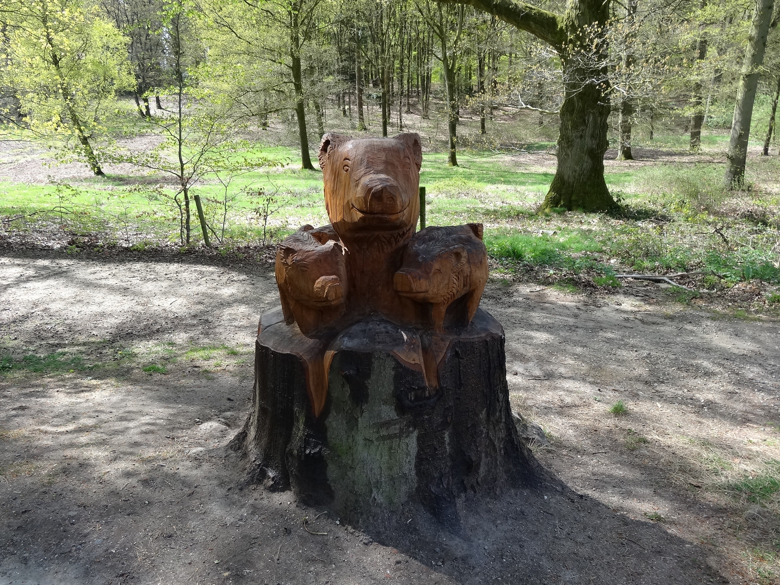 3 brown wooden pig statue