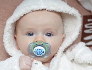 white and green pacifier thumbnail
