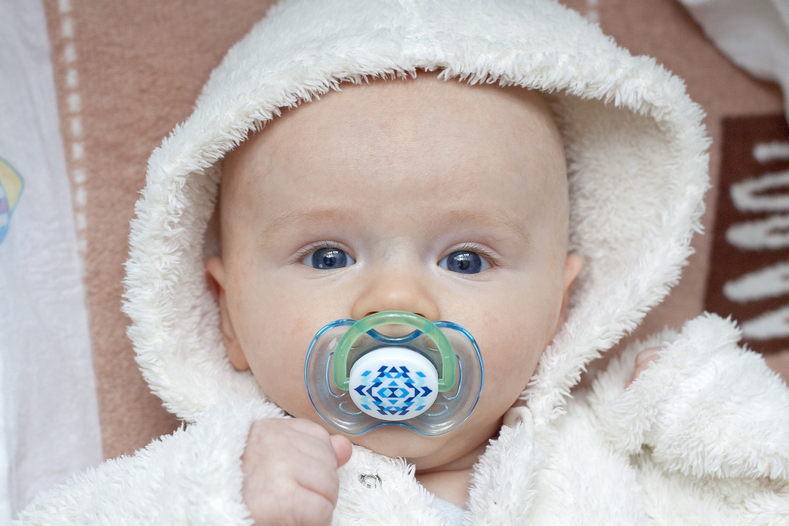 white and green pacifier