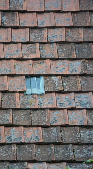 roof tile with gray tile on middle during daytime thumbnail