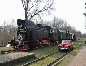 black charcoal train and red classic car thumbnail