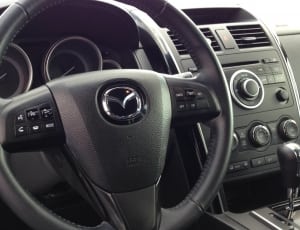 black mazda multi function steering wheel thumbnail