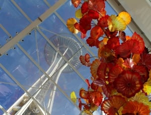 red and yellow flower under tower thumbnail