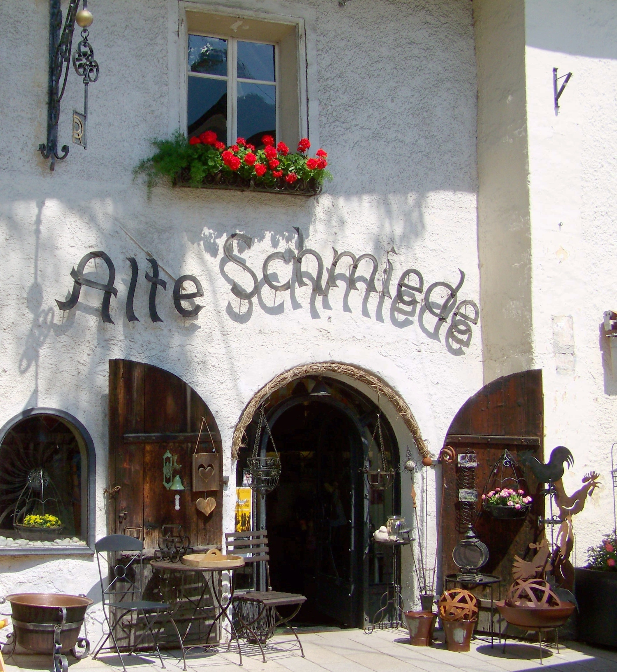 Alte Schmiede signage mount in white concrete wall