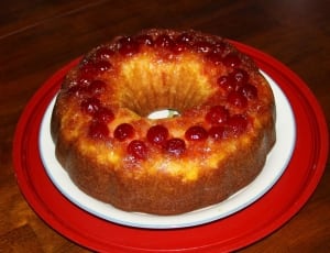 baked round cake with strawberry toppings thumbnail