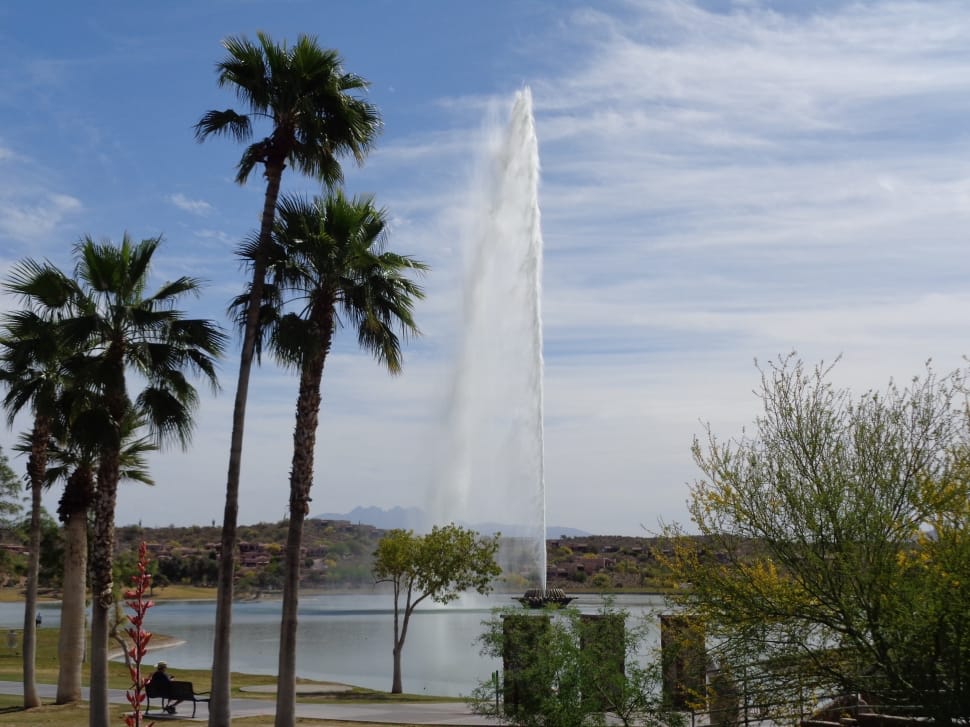 small body of water with fountain on the middle during daytime preview
