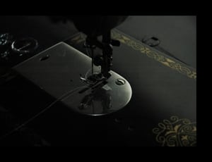 stainless steel and black sewing machine thumbnail