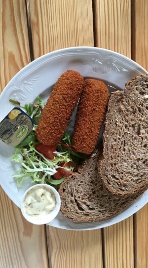 brown sliced bread beside deep fried food on white ceramic plate thumbnail