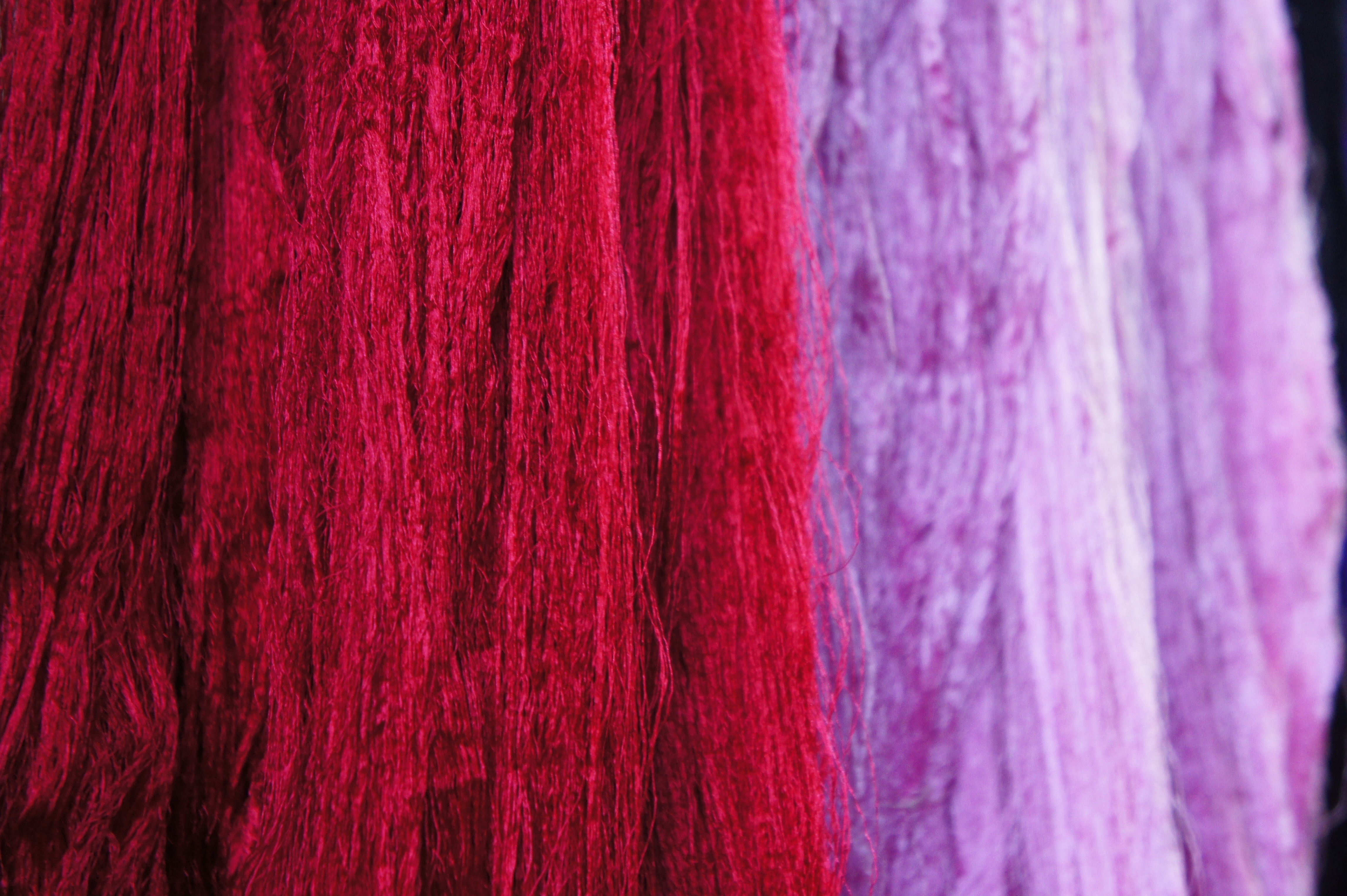 red and purple fringe textile