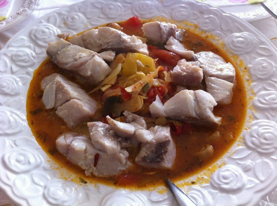 steamed meat cuts on orange soup with bell pepper strips preview