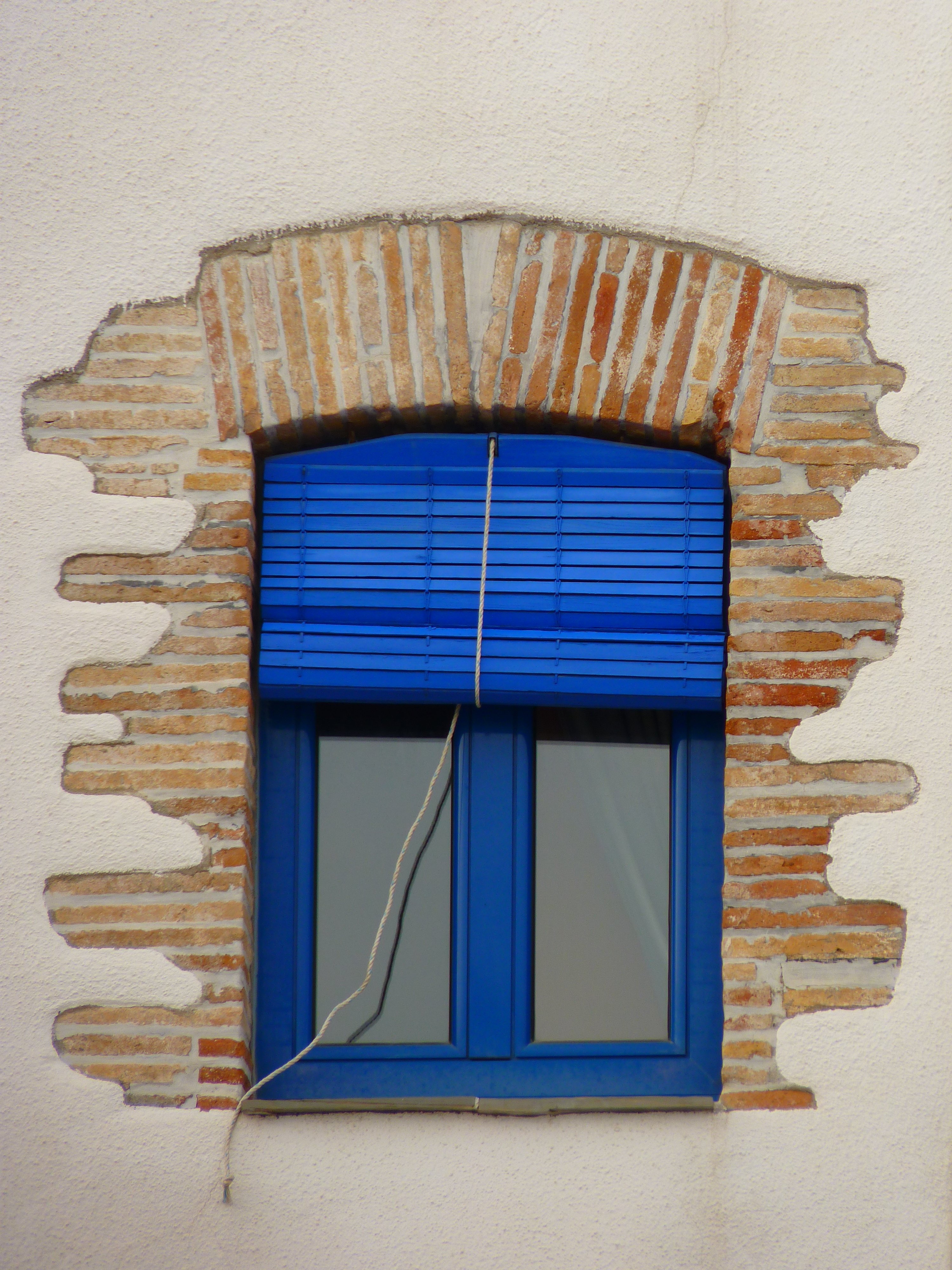 blue wooden frame with clear glass window panel