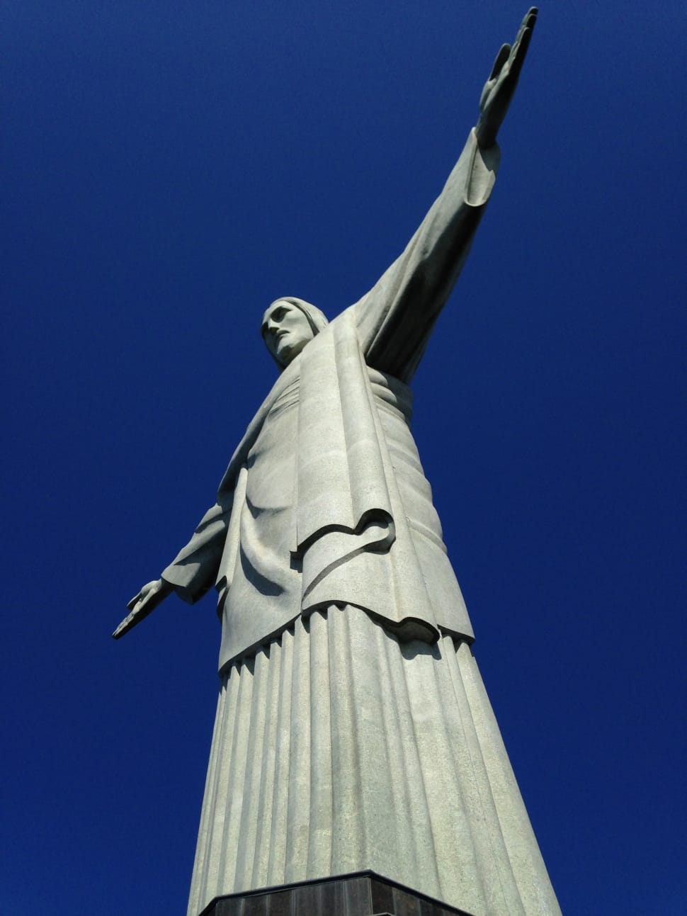 man with arms out statue picture preview