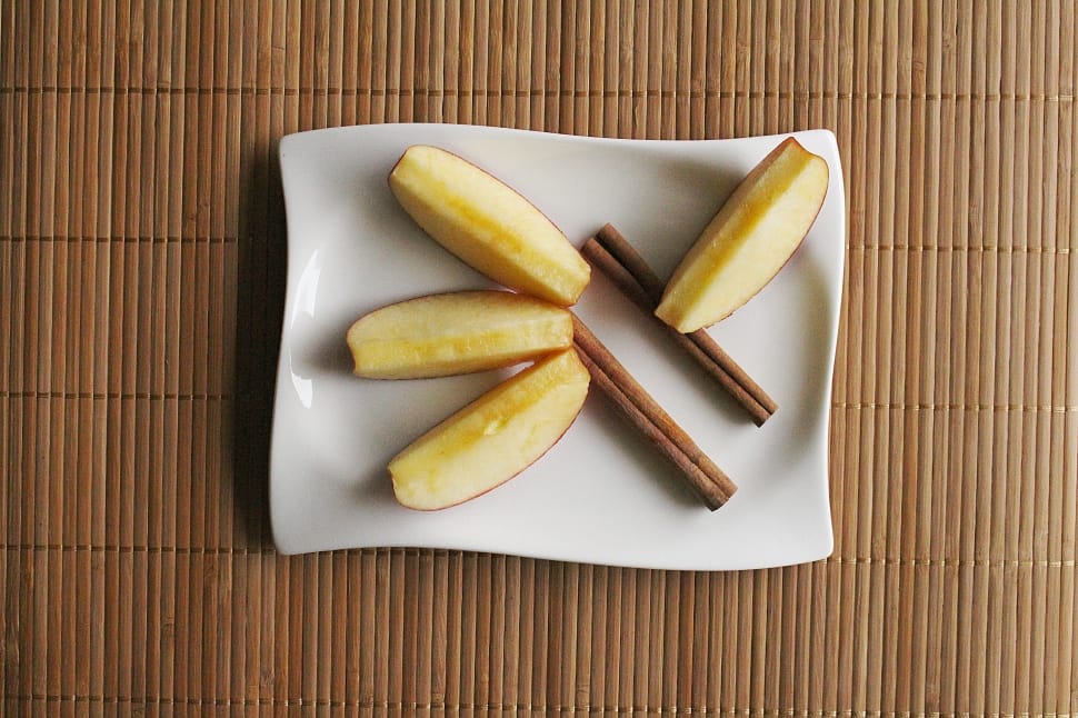 white rectangular ceramic plate with slice apple and sticks preview