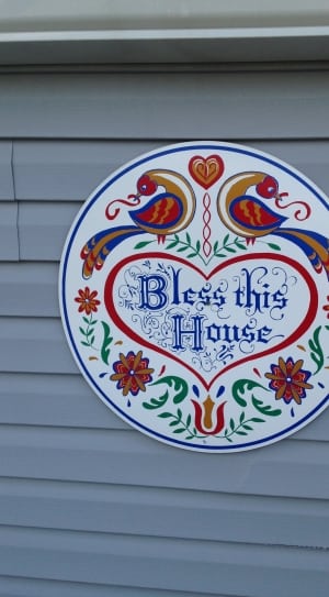 photo of round red and blue bless this home sign thumbnail