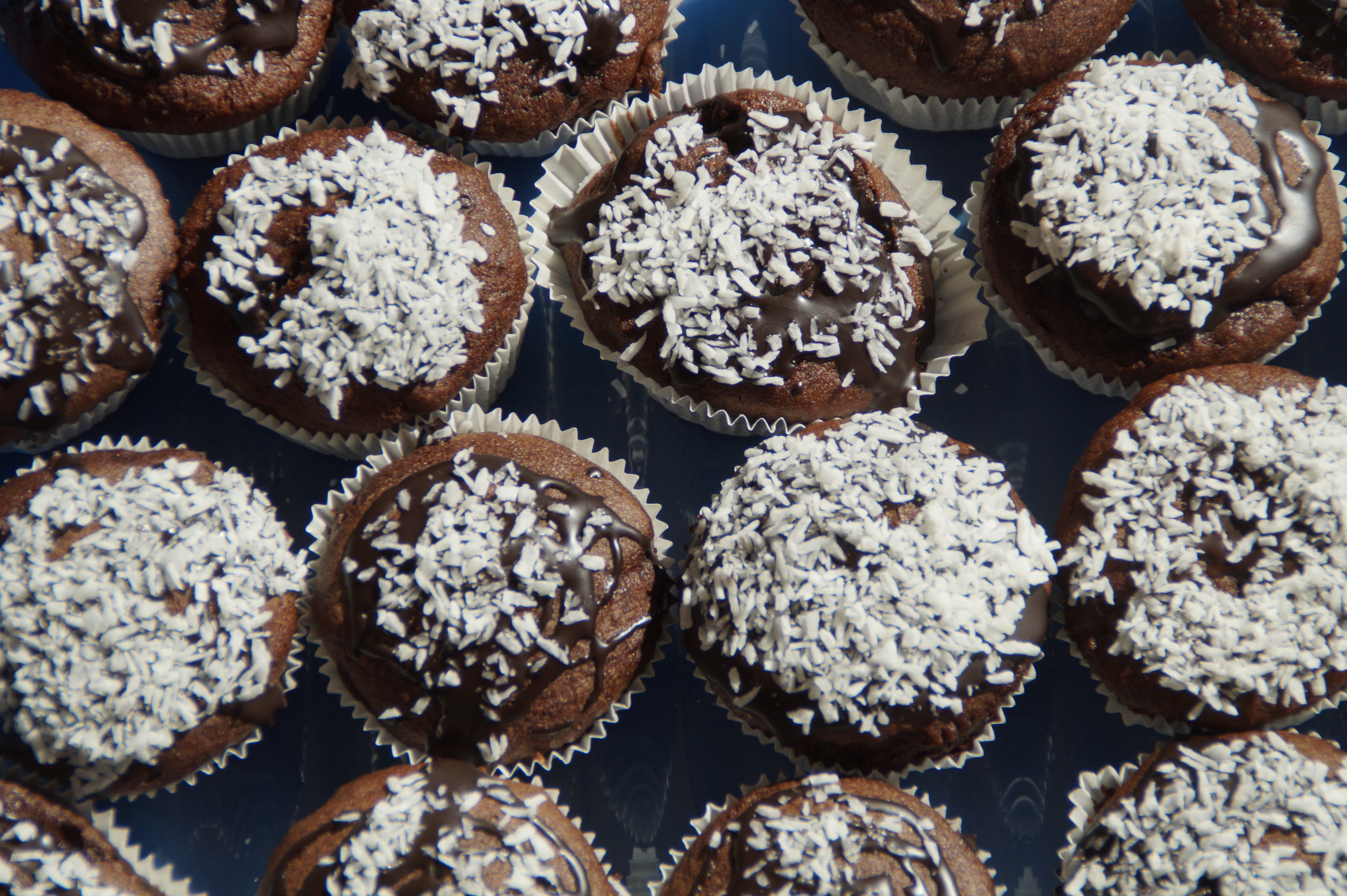 chocolate cupcakes on blue textile