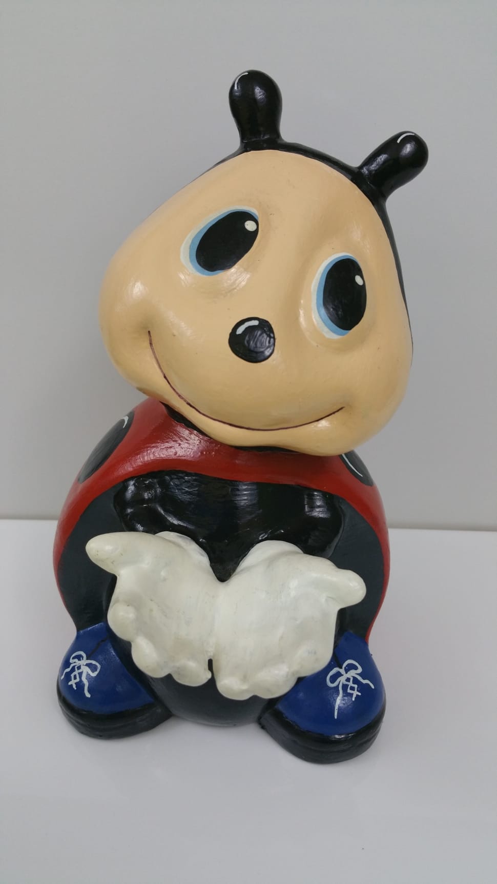 red brown and blue ladybug ceramic figurine preview