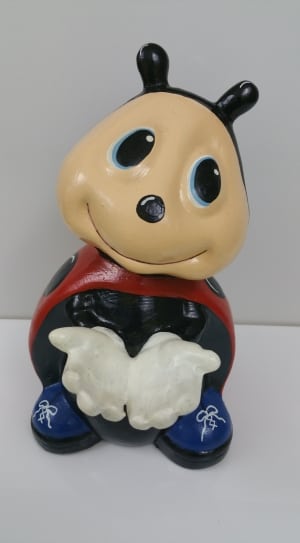 red brown and blue ladybug ceramic figurine thumbnail
